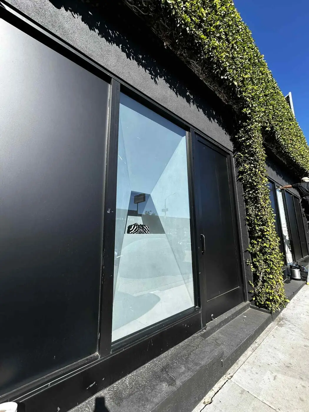 Storefront after reflective privacy film